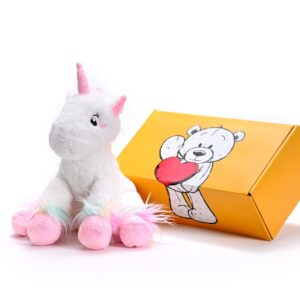 a stuffed unicorn soft toy next to a box