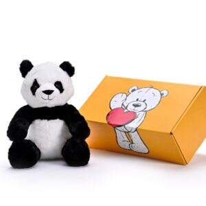 a stuffed panda soft toy next to a box